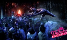 A creature from Stranger Things lunges over an audience wearing 3D glasses.