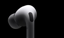 One AirPod Pro on a black background